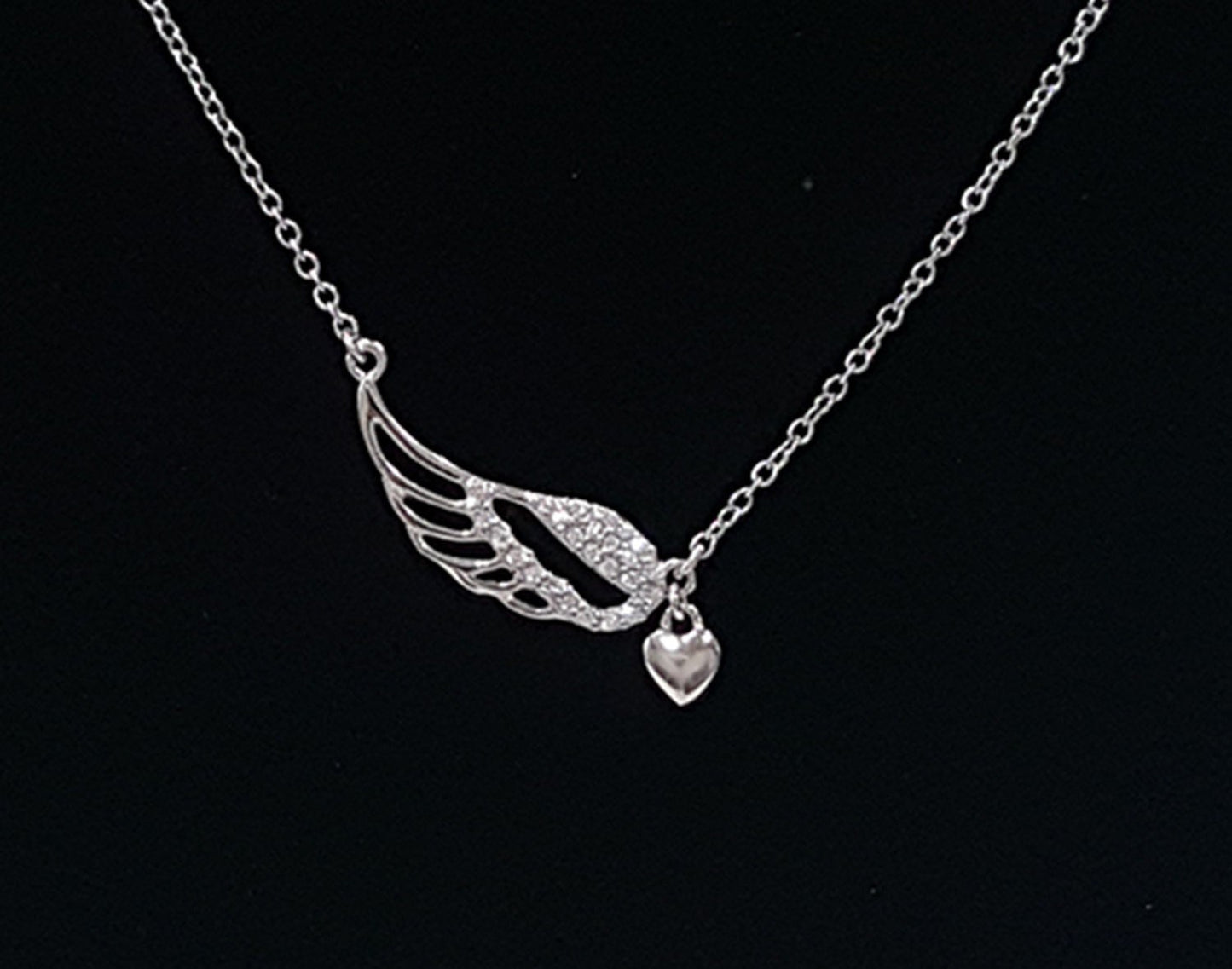.925 Sterling Silver Wing with Cubic Zirconia and Dangling Heart Pendant SY82